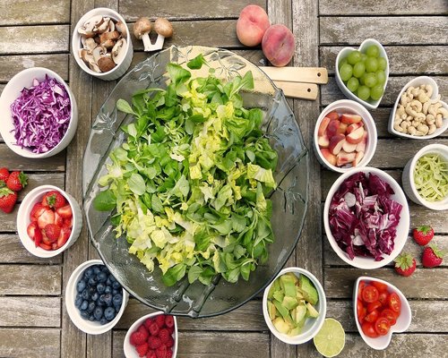 Colorful salad with nuts and fresh vegetables